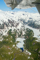 Glaciers, mountains, and snow in and around Taku Inlet taken from a De Haviland DHC-3 Otter of Wings Airways