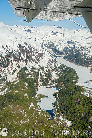 Glaciers, mountains, and snow in and around Taku Inlet taken from a De Haviland DHC-3 Otter of Wings Airways
