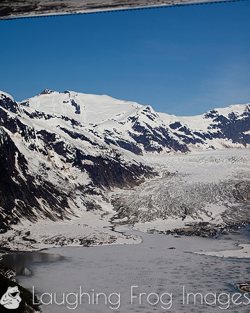Glaciers, mountains, and snow in and around Taku Inlet taken from a De Haviland DHC-3 Otter of Wings Airways