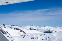 Glaciers, mountains, and snow in and around Taku Inlet taken from a De Haviland DHC-3 Otter of Wings Airways