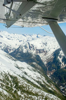 Glaciers, mountains, and snow in and around Taku Inlet taken from a De Haviland DHC-3 Otter of Wings Airways