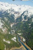 Glaciers, mountains, and snow in and around Taku Inlet taken from a De Haviland DHC-3 Otter of Wings Airways