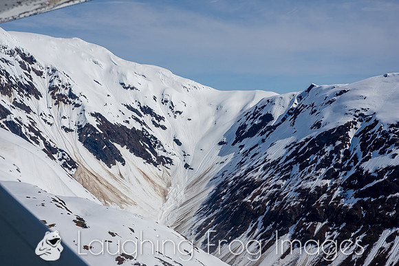 Glaciers, mountains, and snow in and around Taku Inlet taken from a De Haviland DHC-3 Otter of Wings Airways