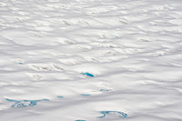 Glaciers, mountains, and snow in and around Taku Inlet taken from a De Haviland DHC-3 Otter of Wings Airways