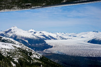 Glaciers, mountains, and snow in and around Taku Inlet taken from a De Haviland DHC-3 Otter of Wings Airways