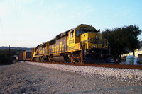 BNSF 8738 - 8721 East wait out the Metrolink rush.  San Dimas, CA. 2