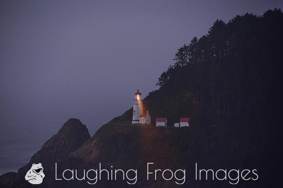 Heceta Head Lightouse and beam at dusk, color