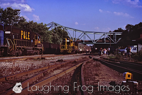 The last train to College arrives at the station and meets a train of empty hoppers.