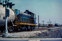 PH&D 60 pulls east across Michigan Road, 4/1984.