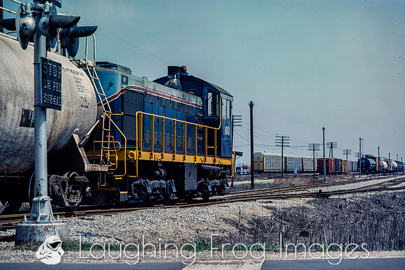 PH&D 60 pulls east across Michigan Road, 4/1984.